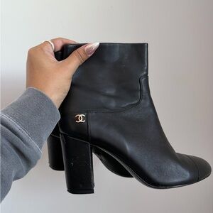 CHANEL Black Heeled Boots with Gold Accent
